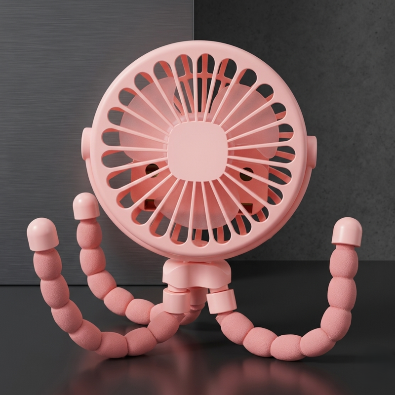 A pink Alphinea baby stroller fan featuring a flexible octopus tripod design, shown standing on its own on a dark surface.