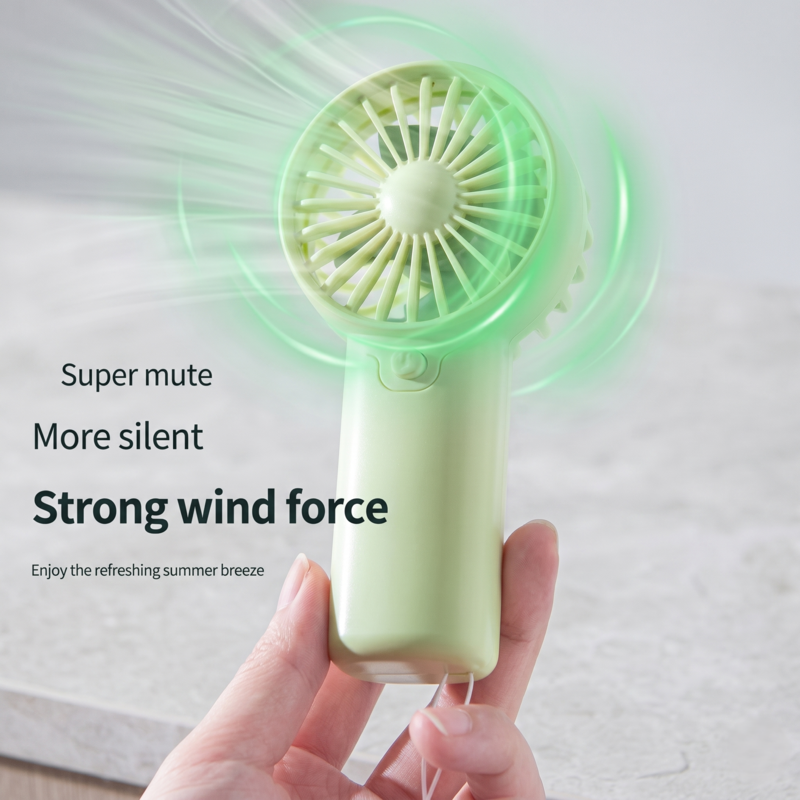 Handheld Alphinea mini fan in mint green showing strong wind force and silent motor feature.