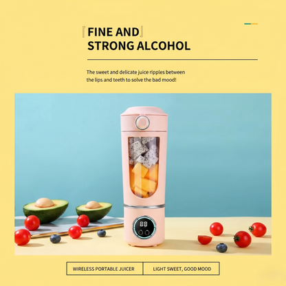 Alphinea 700ML wireless portable blender in pink, filled with fresh dragonfruit and mango. A high-velocity travel juicer sitting on a table next to fresh avocados and tomatoes.