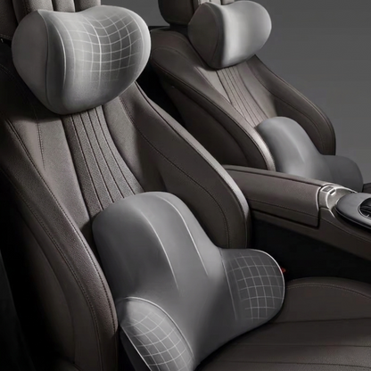 Complete Alphinea ergonomic neck and lumbar support set in gray, fitted to a luxury car seat to provide firm, consistent back and neck support for daily commutes and long hauls.