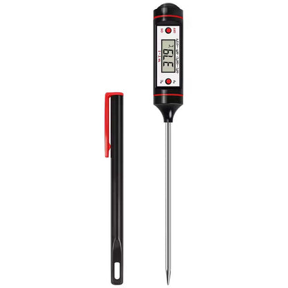The Alphinea digital meat thermometer standing vertically alongside its protective pen-style cover, an essential tool for safe storage and outdoor pitmaster grilling.