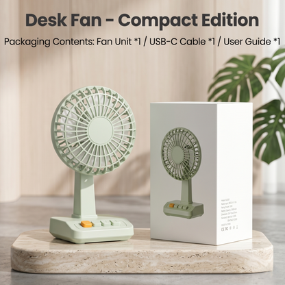 Ventilateur de bureau Alphinea édition compacte présenté à côté de son emballage minimaliste sur un bureau à l'esthétique épurée, propice à un mode de vie lent.