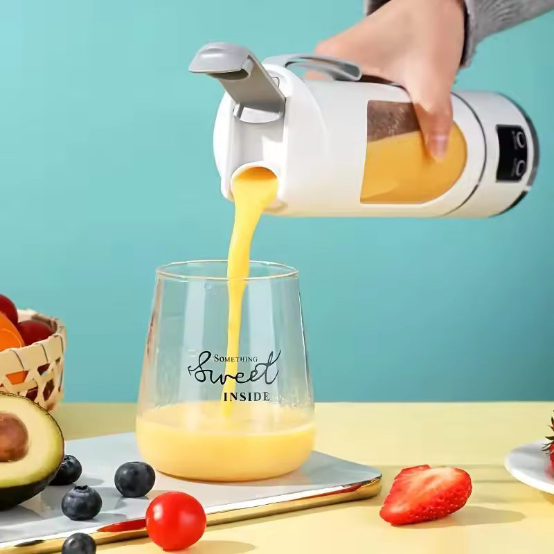 Pouring a smoothly blended, fresh fruit smoothie from the cordless white Alphinea portable blender into a glass cup.