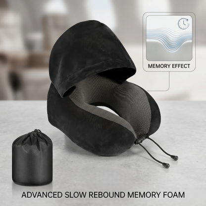 The Alphinea black hooded travel pillow made of advanced slow rebound memory foam, displayed next to its compact black storage bag. An inset graphic highlights the zero-pressure memory effect.