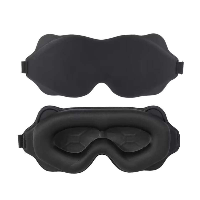 Front and back view of the ultra-lightweight black Alphinea travel eye mask, displaying its sleek exterior and deep internal eye cavities for REM sleep optimization.