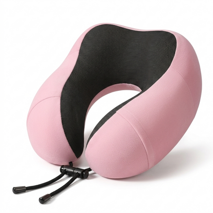 Pink Alphinea U-shaped travel neck pillow showcasing the subtle massage-like inner surface texture to promote blood flow.