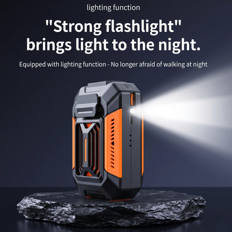 The Alphinea outdoor-grade cooling fan sitting on a rugged rock at night, projecting a bright beam from its built-in flashlight.