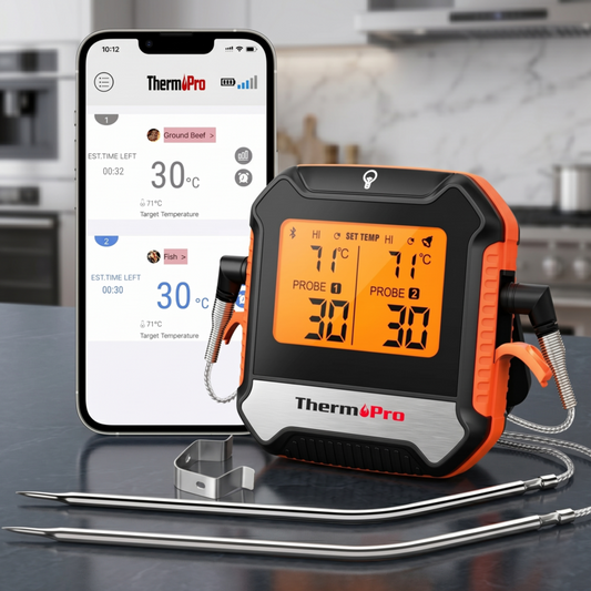 Alphinea smart wireless meat thermometer displaying real-time dual probe temperatures next to its connected smartphone app interface on a modern kitchen counter.