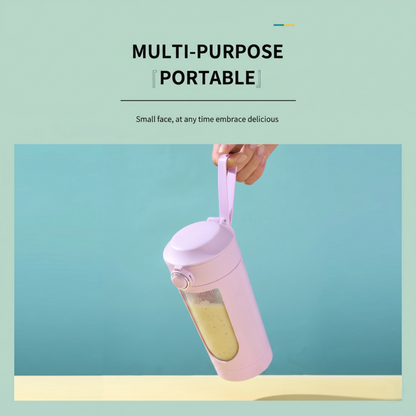A hand holding the pink Alphinea travel-ready portable blender by its built-in strap, showcasing total portability for athletes and professionals on the go.