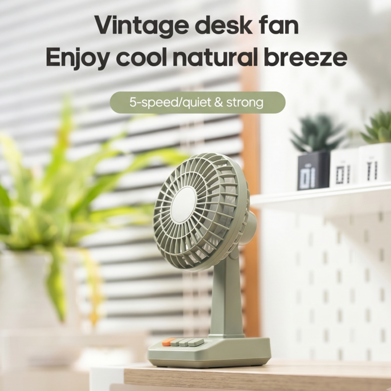 Ventilateur de bureau vintage Alphinea vert pastel posé sur un bureau minimaliste en bois, offrant une brise naturelle et rafraîchissante pour un espace de travail esthétique.