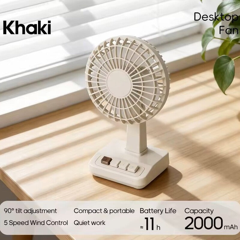 Khaki Alphinea vintage desk fan on a sunlit wooden desk, perfectly complementing a neutral, minimalist lifestyle workspace.