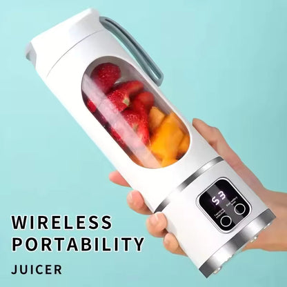 A hand holding the white Alphinea wireless portable juicer, showcasing its lightweight design, filled with sliced strawberries and mangoes.